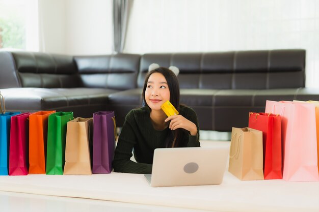 Portrait beautiful young asian woman with shopping bag and credit card