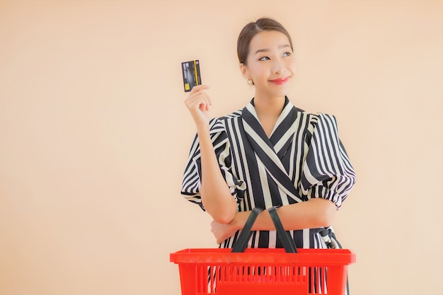 Portrait beautiful young asian woman with shopping basket