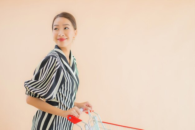 Portrait beautiful young asian woman with shopping cart