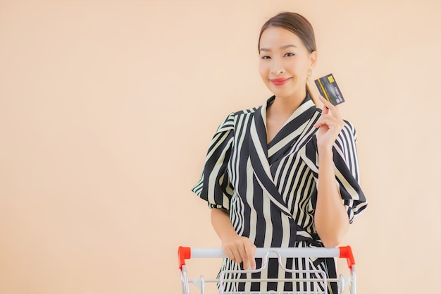 Portrait beautiful young asian woman with shopping cart