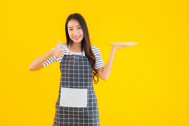 Portrait beautiful young asian woman with white dish or plate