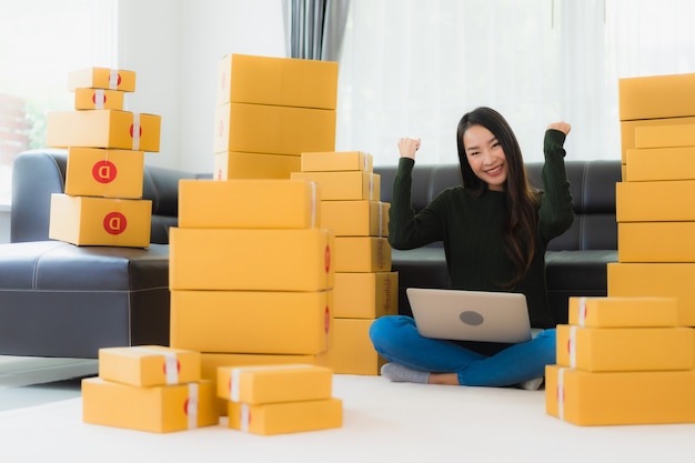 Portrait beautiful young asian woman work at home and ready for shipping