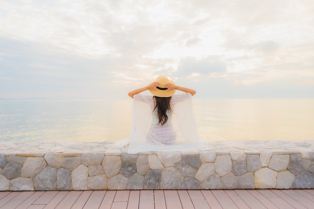 Free photo portrait beautiful young asian women happy smile relax around sea beach ocean