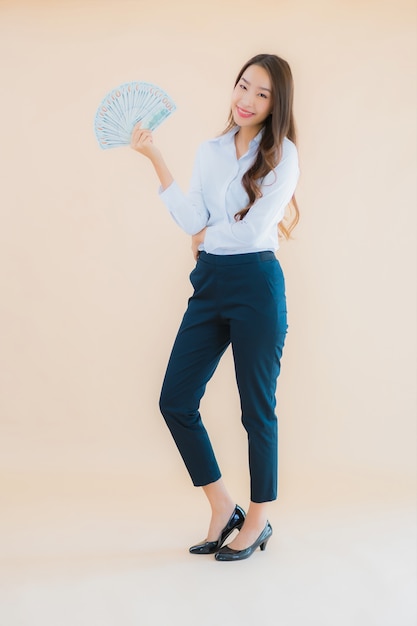 Portrait beautiful young business asian woman with cash or money