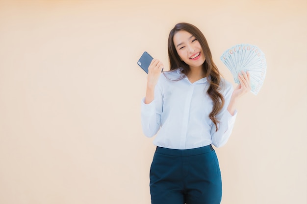 Portrait beautiful young business asian woman with cash or money