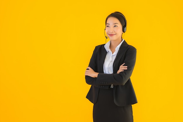 Portrait beautiful young business asian woman with headphone or headset