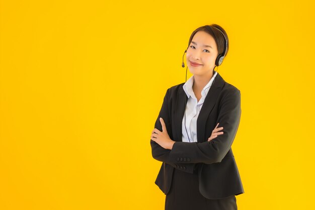 Portrait beautiful young business asian woman with headphone or headset