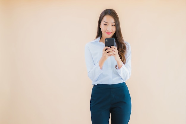 Portrait beautiful young business asian woman with smart mobile phone and coffee cup