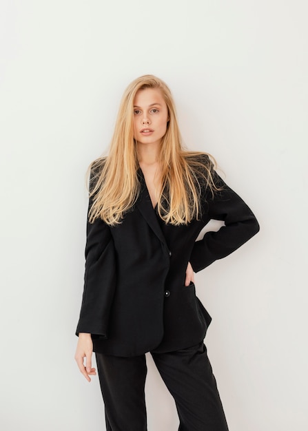 Portrait of beautiful young female wearing formal suit