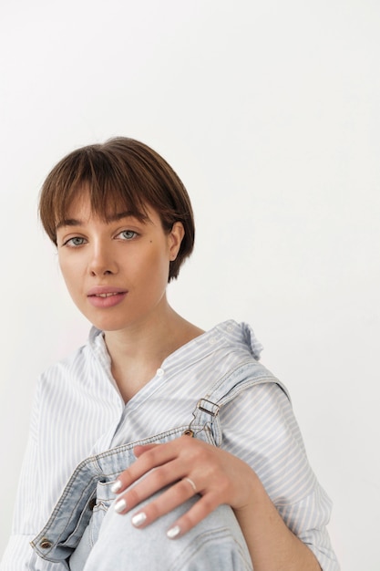 Portrait of beautiful young female wearing jumpsuit