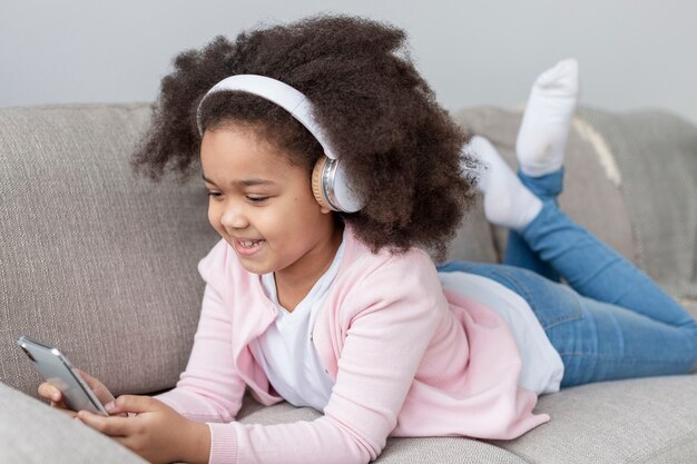 Portrait of beautiful young girl listening to music