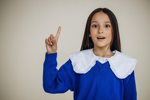 Portrait of beautiful young girl showing emotions isolated in studio