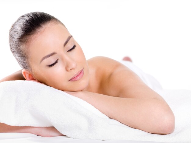 Portrait of beautiful young relaxing woman - white background