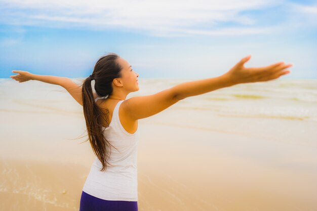 Portrait beautiful young sport asian woman exercise by run and jogging on the outdoor nature beach and sea