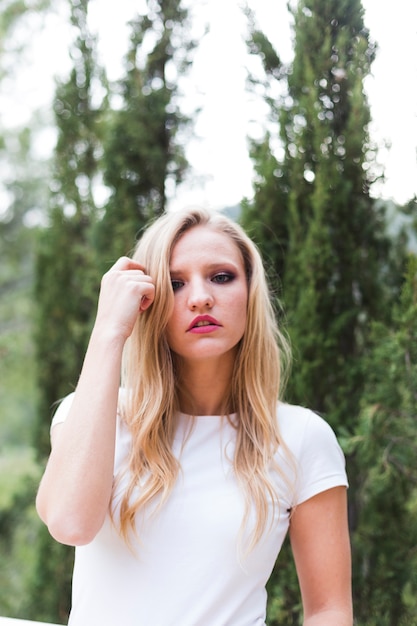 Portrait of beautiful young woman looking at camera