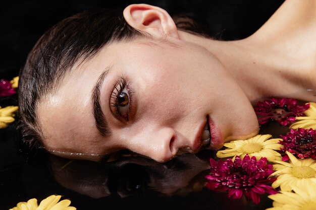 Portrait of beautiful young woman at spa