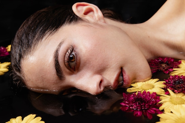 Portrait of beautiful young woman at spa