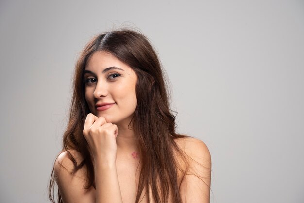 Portrait of beautiful young woman standing 