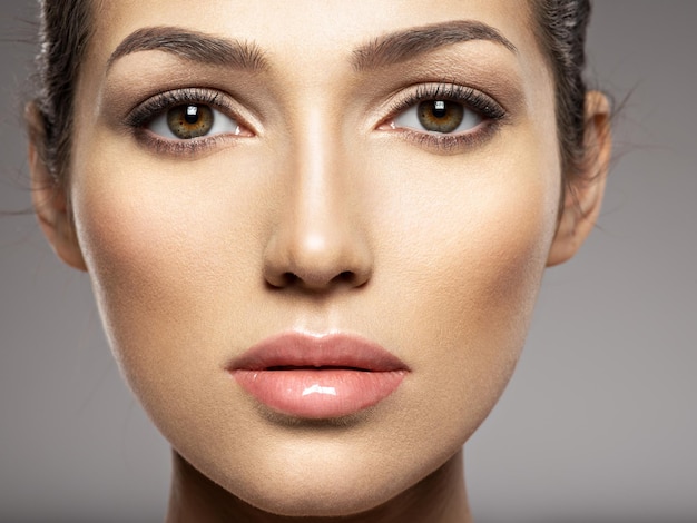 Portrait of beautiful young  woman with clean face. Beautiful woman face close up 