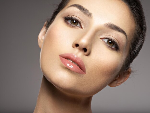 Portrait of beautiful young  woman with clean face. Beautiful woman face close up 