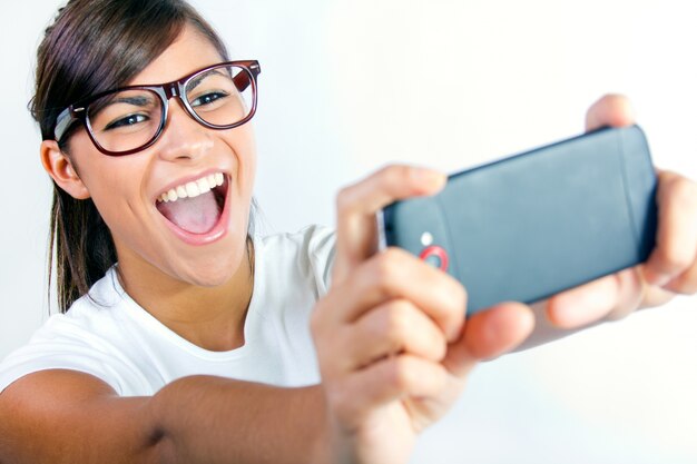 Portrait of beautiful young woman with mobile.