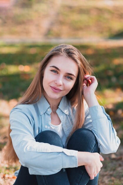 Portrait of blonde woman looking at photographer