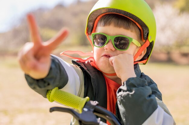 Portrait boy riding bicycle