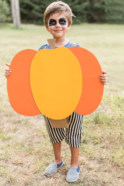 Portrait boy with pumpkin costume