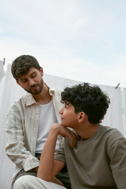 Free photo portrait of brothers spending time together outdoors