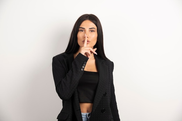 Portrait of brunette girl posing on white background. High quality photo