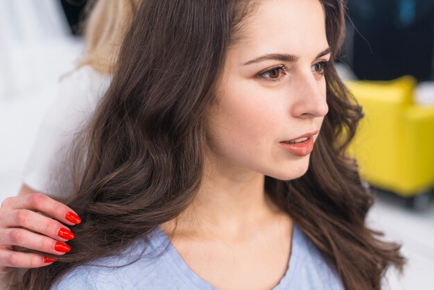 Portrait of brunette in hair salon