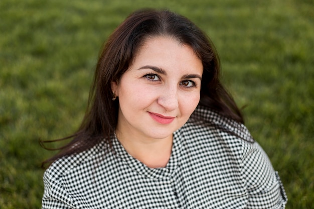 Portrait of brunette smiley woman