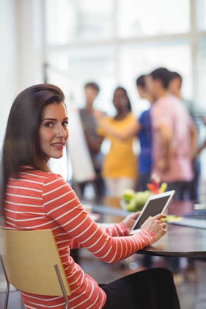 Portrait of business executive using digital tablet