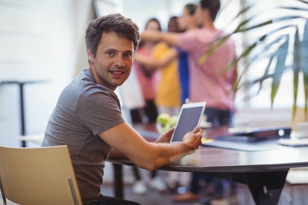 Portrait of business executive using digital tablet