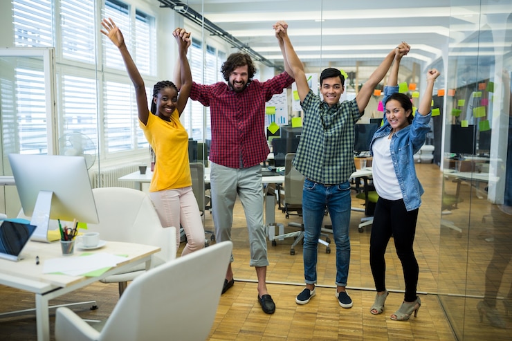 Free Photo portrait of business executives raising arms