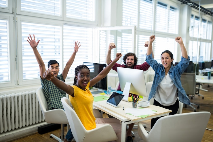 Free Photo portrait of business executives raising arms