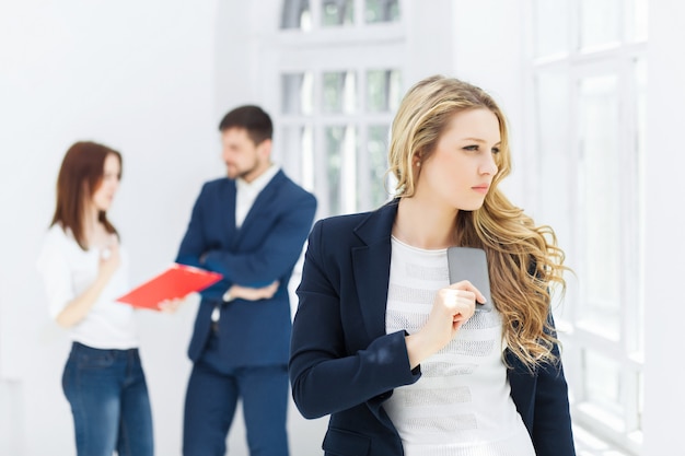 Portrait of businesswoman talking on phone in office