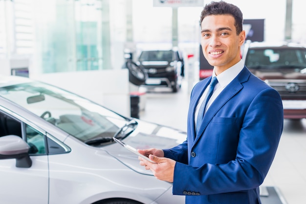 Portrait of car salesman