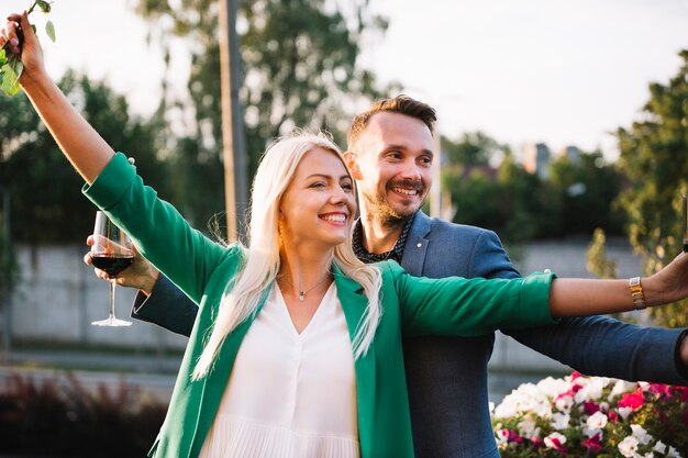 Portrait of carefree young smiling couple at park