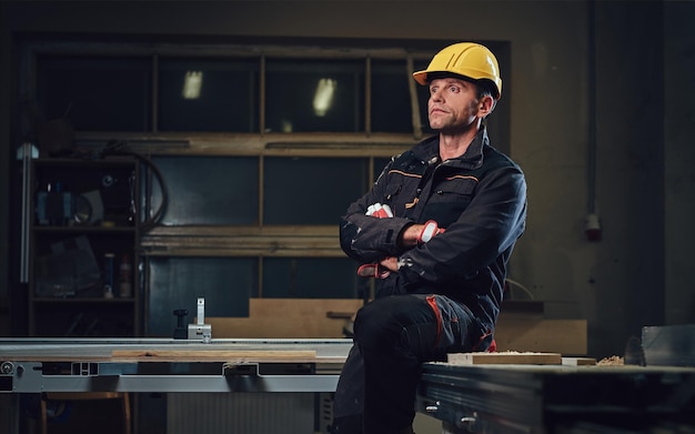 Portrait of carpenter male in a workshop.