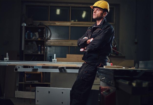 Free photo portrait of carpenter male in a workshop.