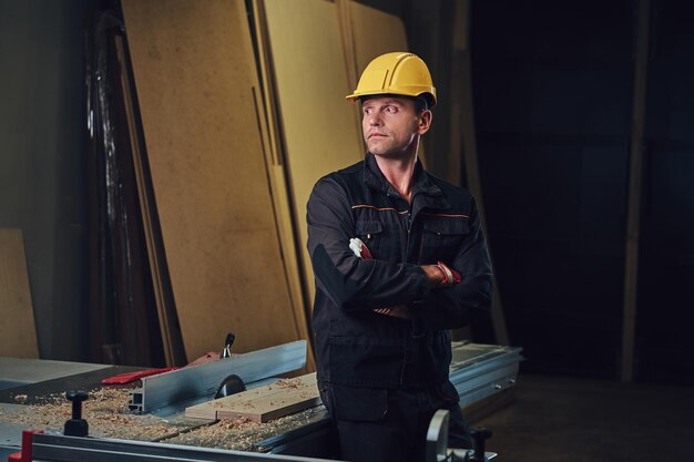 Portrait of carpenter male in a workshop.