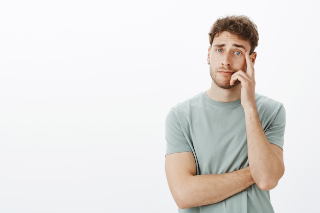 Portrait of a casual guy posing in the studio