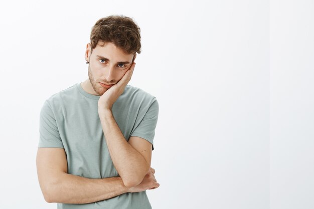 Portrait of a casual guy posing in the studio