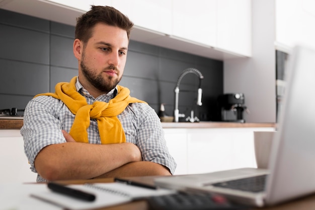 Free photo portrait of casual male video conferencing