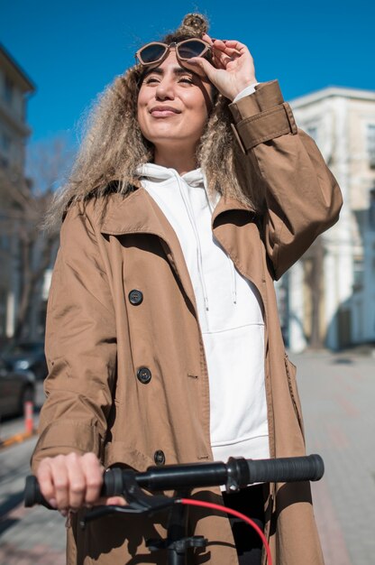 Portrait of casual teenager on electric scooter