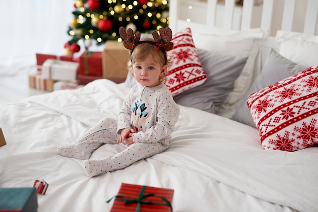 Portrait of charming baby in Christmas morning