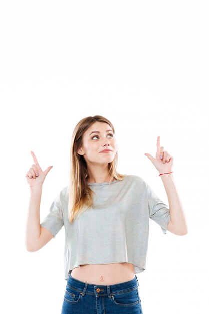 Portrait of a cheerful cute young woman standing