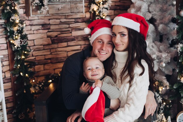 Portrait of a cheerful family with one small child having fun together