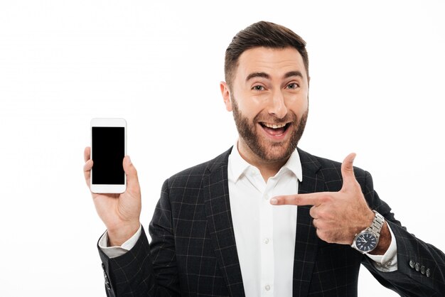 Portrait of a cheerful smiling man pointing finger